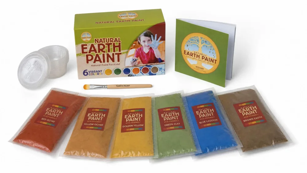 The Natural Earth Paint Children's Kit laid out with its six pigment packets, lidded mixing cups, bamboo brush, and instructional activity booklet.