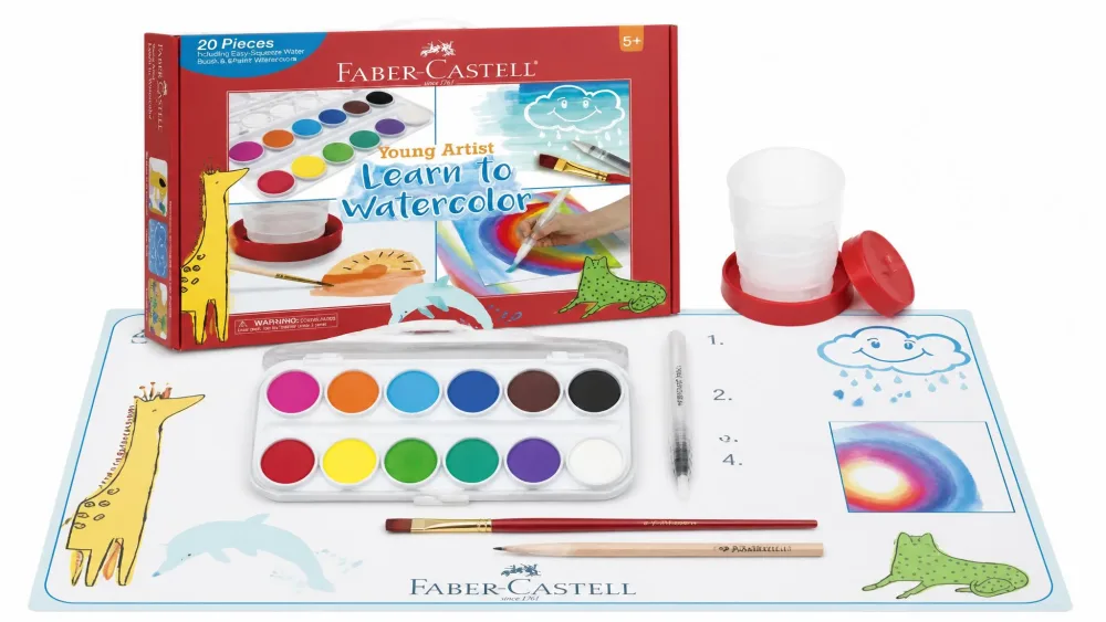 The full Faber-Castell Young Artist Learn to Watercolor kit laid out on a painting mat.