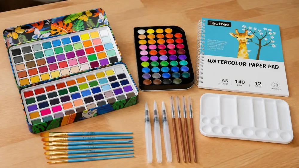 The Taotree 48-color kit's brushes, water pens, palette, and spiral drawing pad spread across a table.
