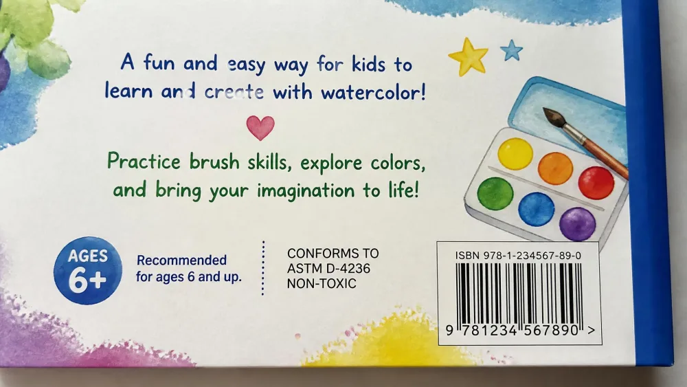 A close-up of the back cover of a children's watercolor workbook showing the printed Conforms to ASTM D-4236 non-toxic safety label alongside the age recommendation text.