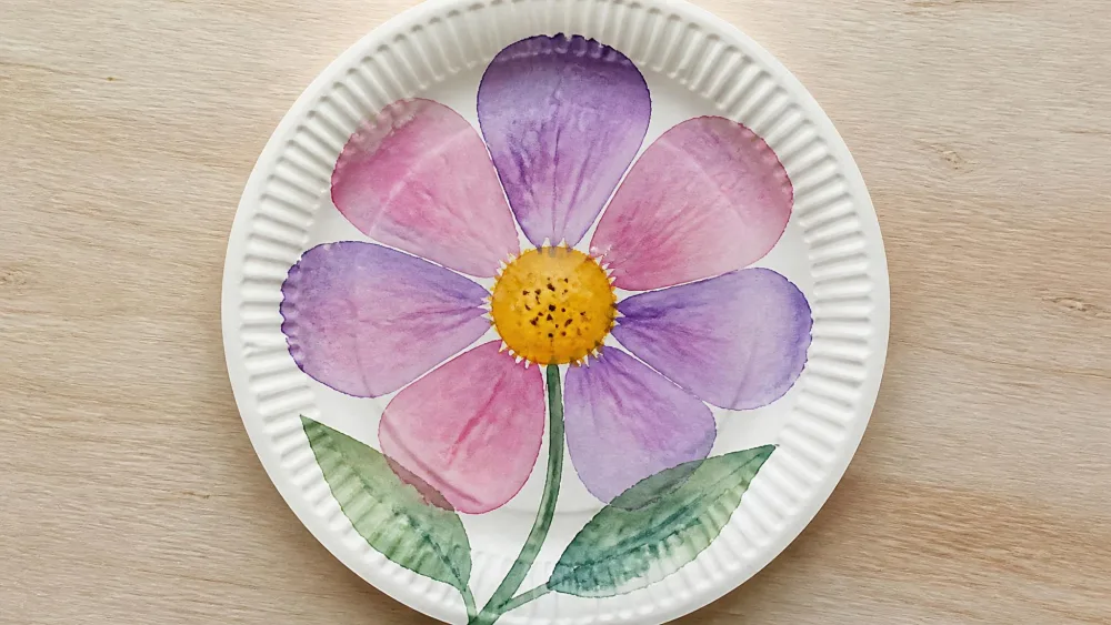 A paper plate painted as a watercolor flower.