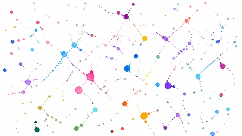 Watercolor splatter specks flung across white paper.