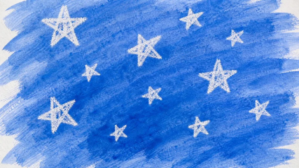 Blue watercolor brushed across a page, revealing white crayon stars underneath.
