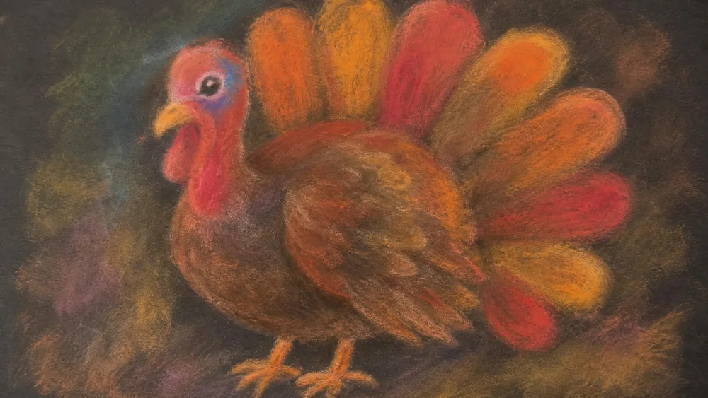 A turkey blended from fall-colored chalk pastels with a child's smudged fingertips.
